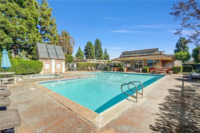 view of swimming pool featuring a patio