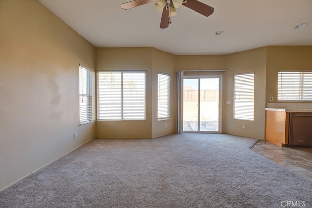 interior space featuring a wealth of natural light and ceiling fan