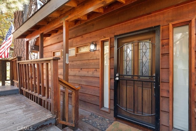 property entrance featuring covered porch