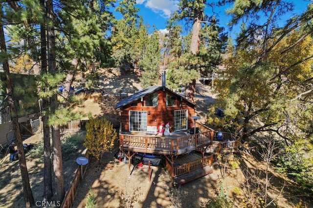 rear view of property with a wooden deck