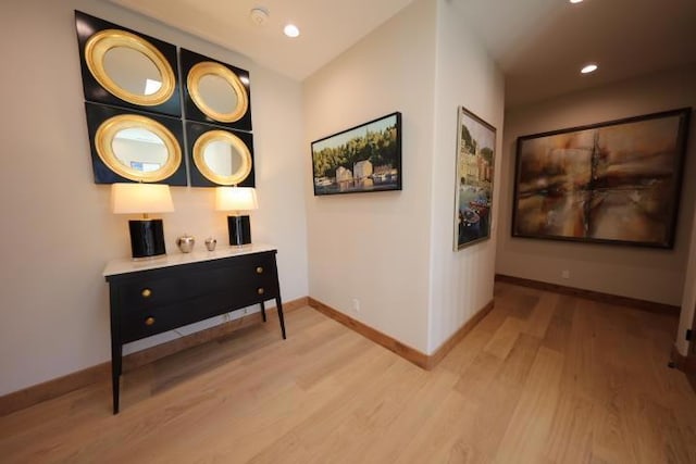 hall with light hardwood / wood-style floors