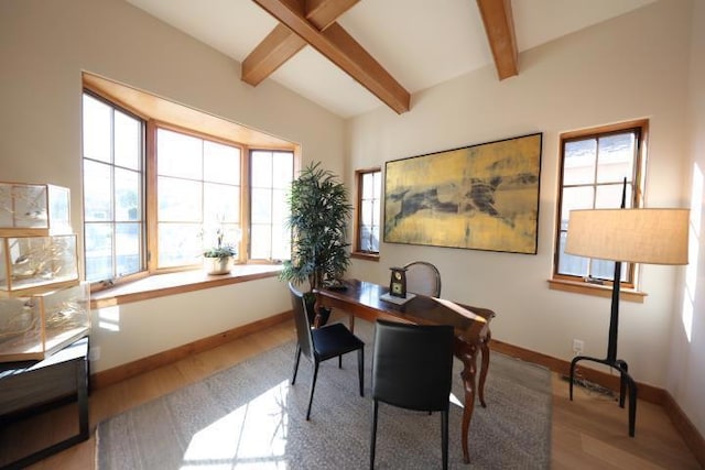 office area with hardwood / wood-style floors and beam ceiling