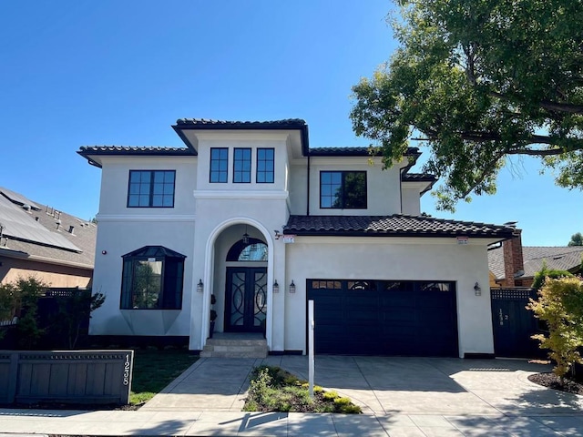 mediterranean / spanish-style home featuring a garage