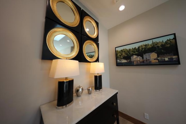 hallway featuring vaulted ceiling