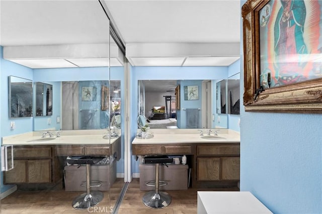 bathroom with vanity and hardwood / wood-style flooring