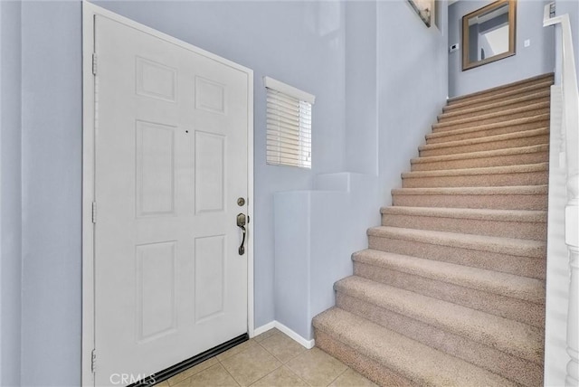 entrance foyer with light tile patterned floors