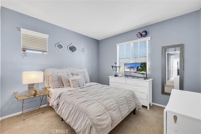 bedroom with light carpet