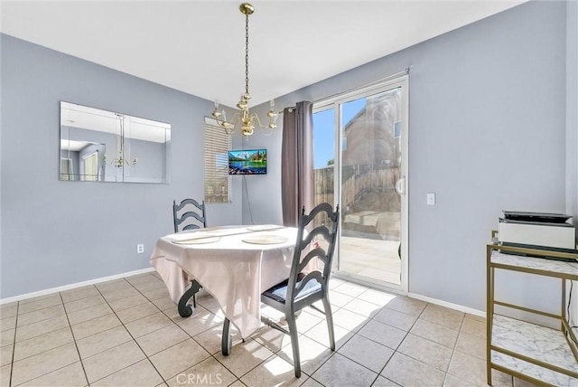 tiled dining area with a chandelier