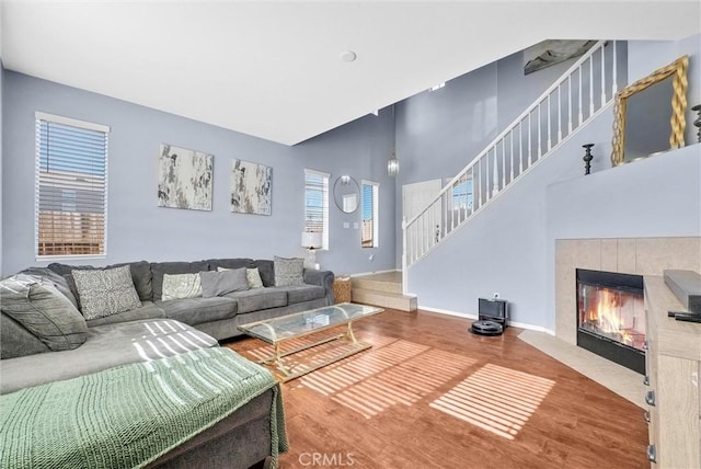 living room with a fireplace and hardwood / wood-style floors