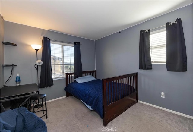 bedroom featuring light carpet