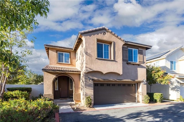 mediterranean / spanish-style house featuring a garage