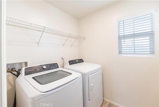 clothes washing area featuring washing machine and dryer