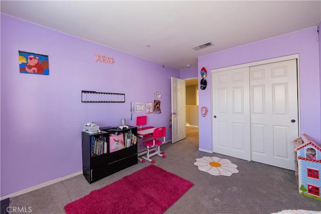 carpeted bedroom with a closet