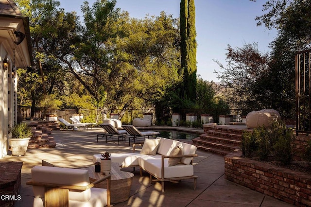 view of patio / terrace with outdoor lounge area and a fenced in pool