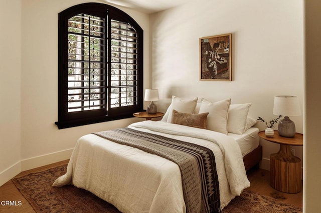 bedroom with wood-type flooring