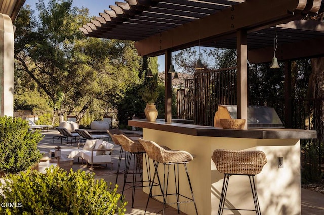 view of patio with an outdoor hangout area, an outdoor bar, and grilling area