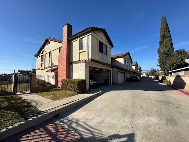 view of side of home with a garage