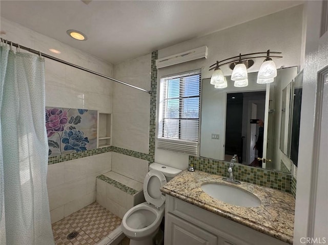 bathroom featuring a shower with shower curtain, vanity, and toilet