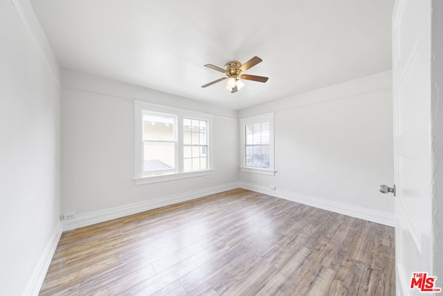 unfurnished room with ceiling fan and light hardwood / wood-style floors