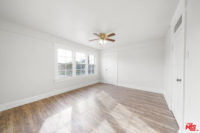 unfurnished bedroom with ceiling fan and light hardwood / wood-style floors