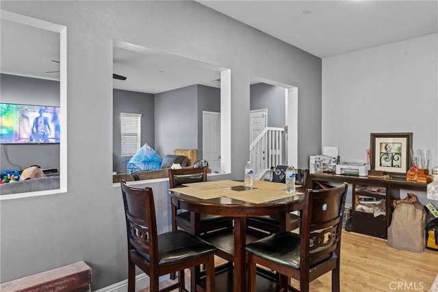 dining space with light wood-type flooring