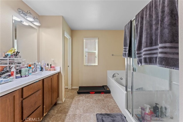 bathroom with vanity and independent shower and bath