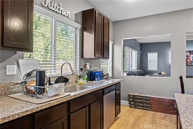 kitchen with dishwasher, dark brown cabinets, light hardwood / wood-style flooring, and sink