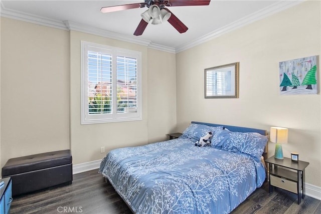 bedroom with dark hardwood / wood-style flooring, ceiling fan, and crown molding