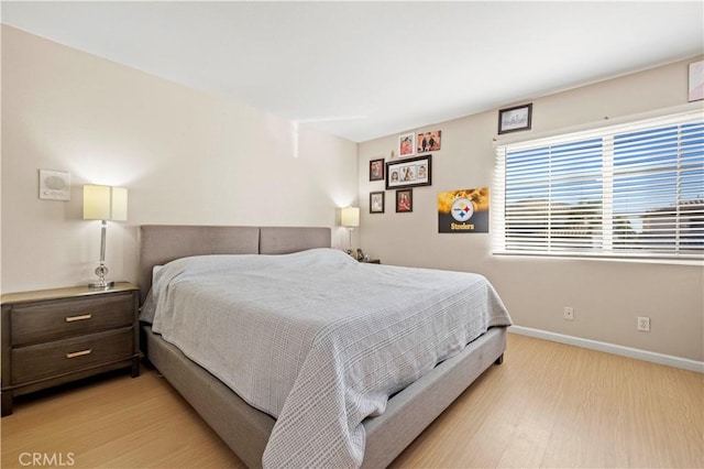 bedroom with light wood-type flooring