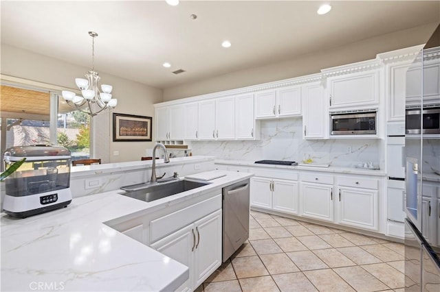 kitchen with sink, white cabinets, and stainless steel appliances