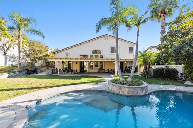 view of swimming pool featuring a yard and a patio