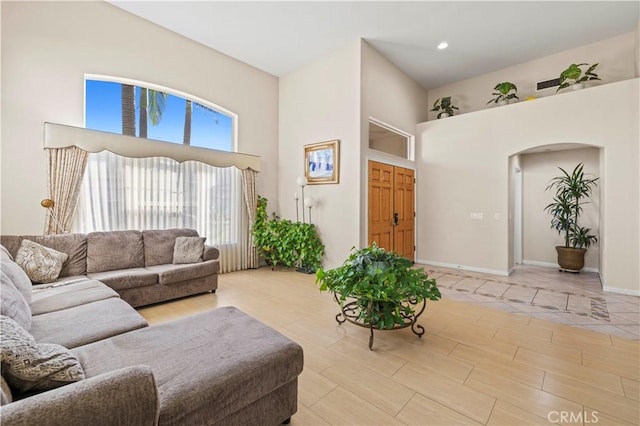 living room with a towering ceiling