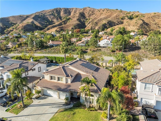 birds eye view of property with a mountain view