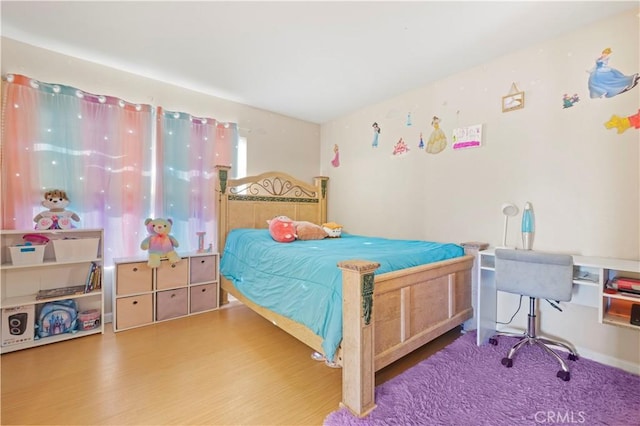 bedroom featuring hardwood / wood-style floors