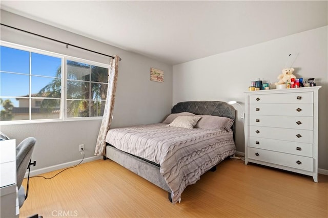 bedroom with light hardwood / wood-style floors