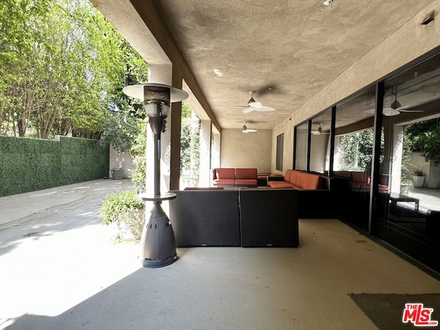 view of patio / terrace featuring ceiling fan and an outdoor hangout area