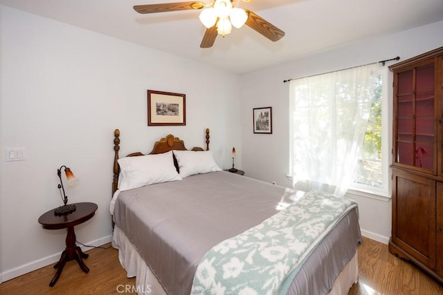 bedroom featuring ceiling fan and light hardwood / wood-style floors