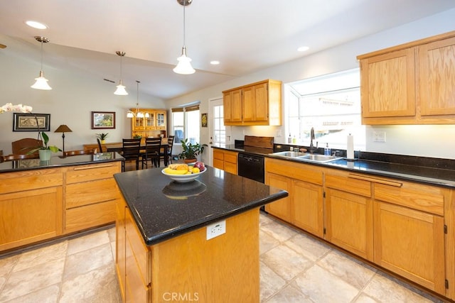 kitchen featuring pendant lighting, a kitchen island, lofted ceiling, and sink