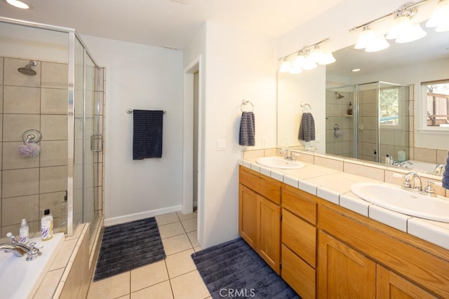 bathroom featuring tile patterned floors, vanity, and plus walk in shower