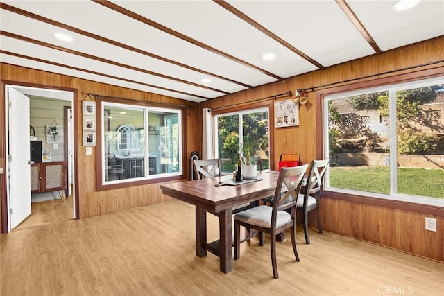 sunroom / solarium featuring lofted ceiling