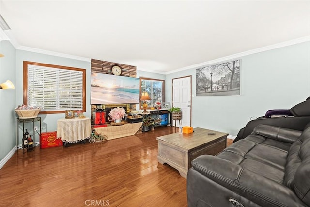 living room with crown molding and hardwood / wood-style floors