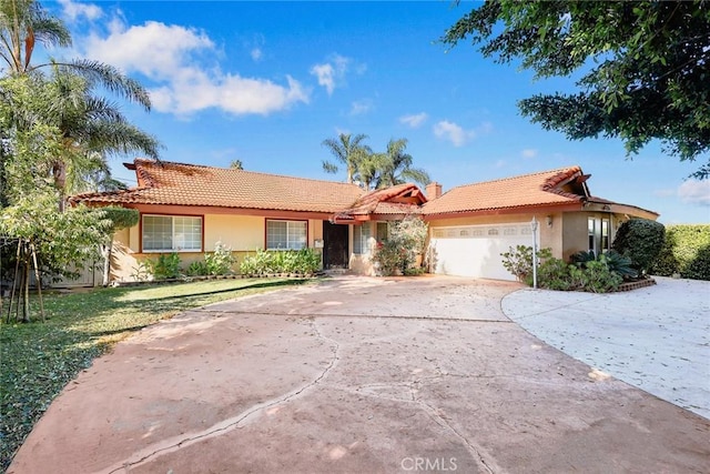 ranch-style home featuring a garage