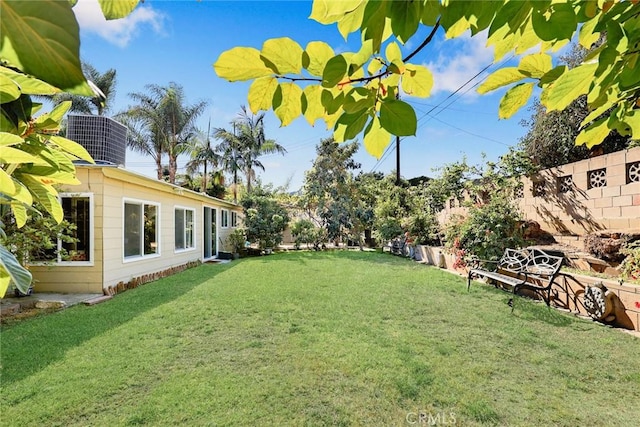 view of yard with central AC