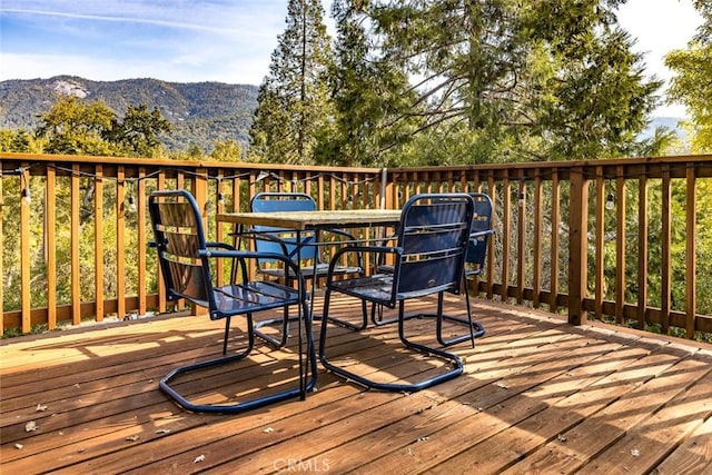 wooden terrace with a mountain view