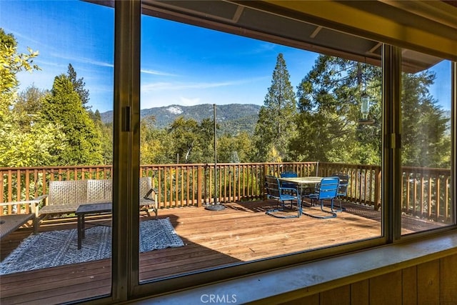 wooden deck with a mountain view