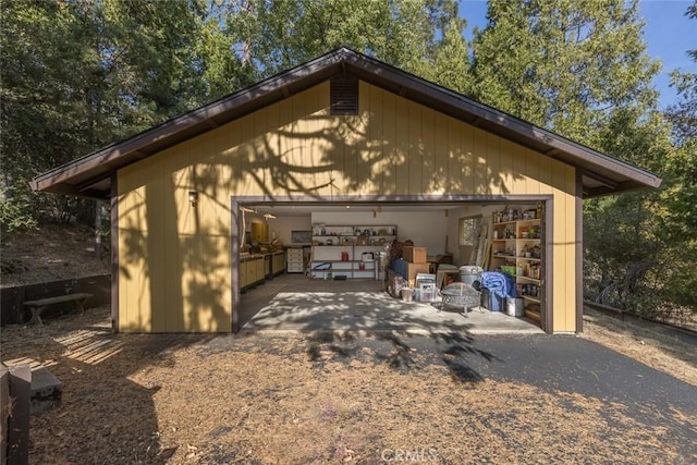 view of side of home with an outbuilding and a garage