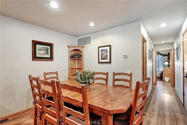 dining room with light hardwood / wood-style flooring