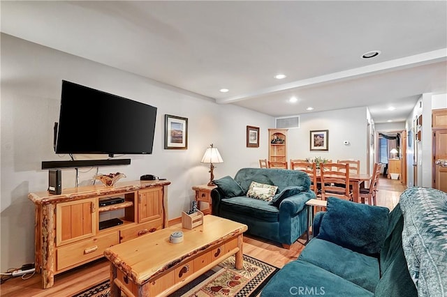 living room with light hardwood / wood-style floors