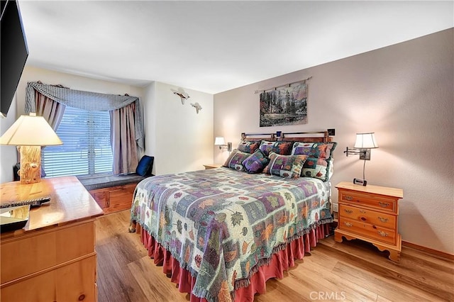 bedroom featuring light wood-type flooring