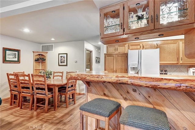 dining space with light hardwood / wood-style floors